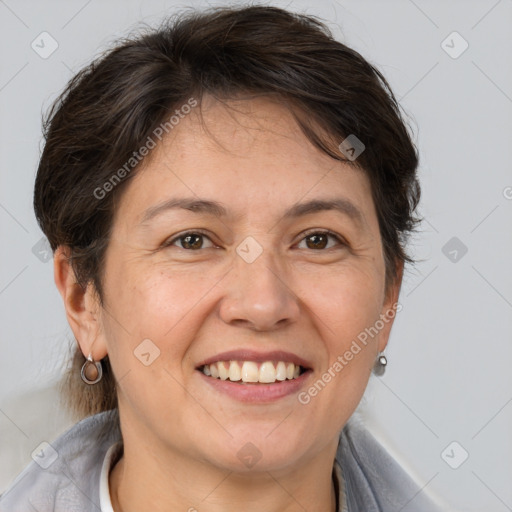 Joyful white adult female with short  brown hair and brown eyes