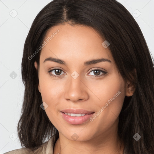 Joyful latino young-adult female with long  brown hair and brown eyes