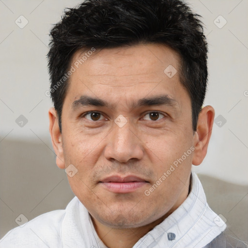 Joyful white adult male with short  brown hair and brown eyes