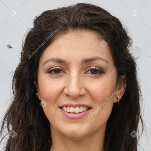 Joyful white adult female with long  brown hair and brown eyes