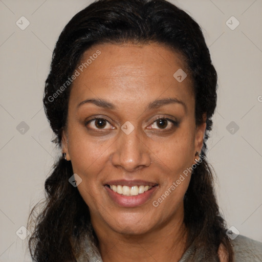 Joyful black adult female with medium  brown hair and brown eyes