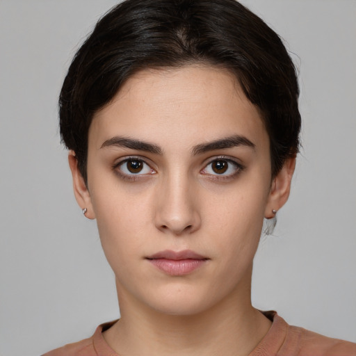 Neutral white young-adult female with short  brown hair and brown eyes