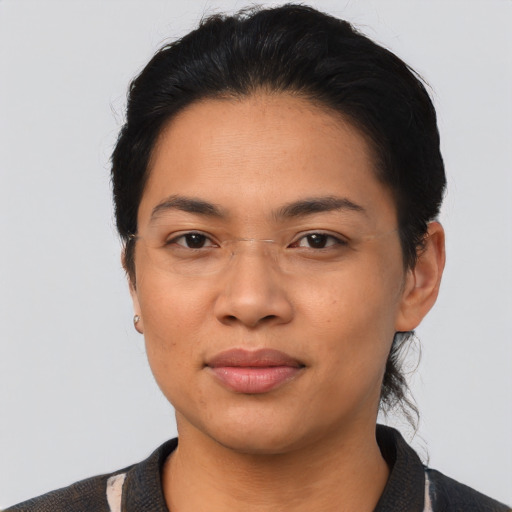 Joyful asian young-adult female with short  black hair and brown eyes