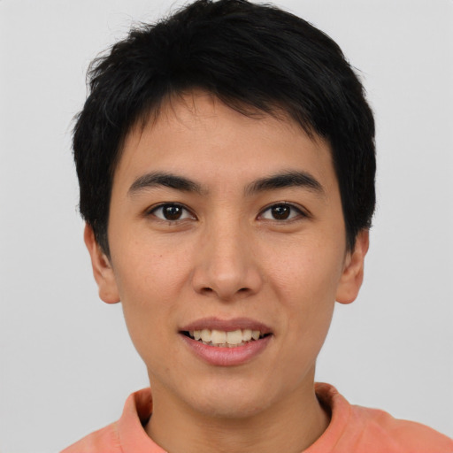 Joyful asian young-adult male with short  brown hair and brown eyes