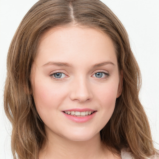 Joyful white young-adult female with long  brown hair and green eyes