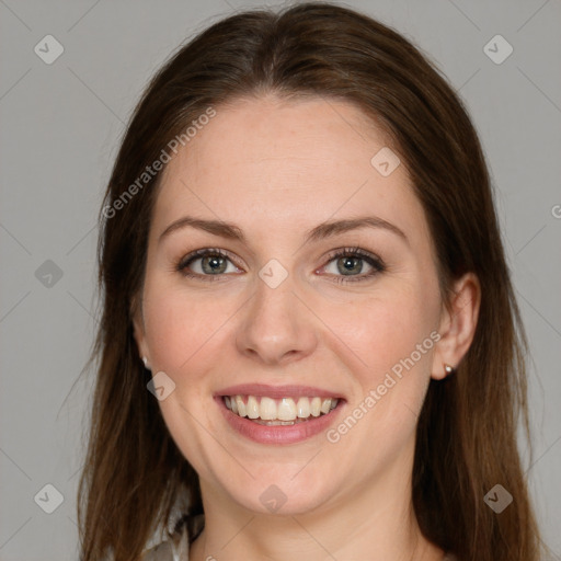 Joyful white young-adult female with long  brown hair and grey eyes