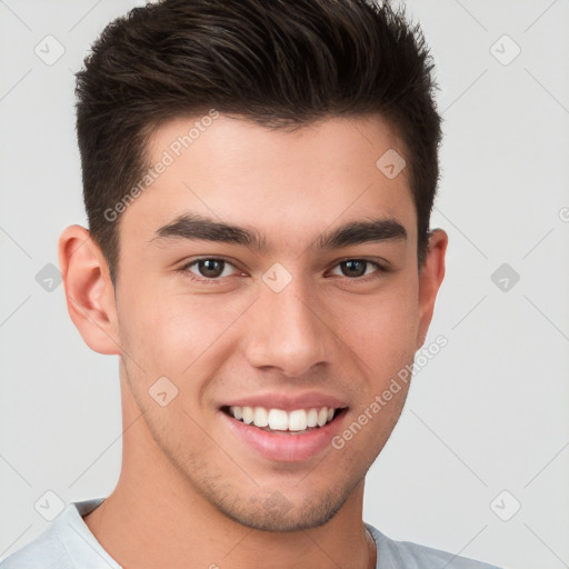 Joyful white young-adult male with short  brown hair and brown eyes