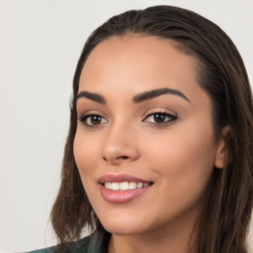 Joyful white young-adult female with long  black hair and brown eyes