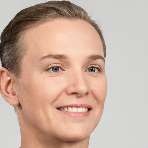 Joyful white young-adult female with short  brown hair and brown eyes