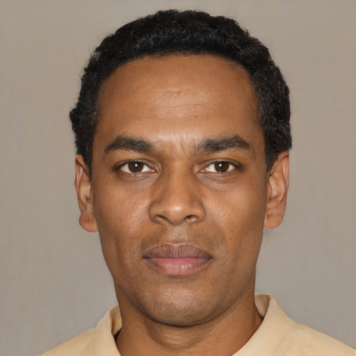 Neutral black young-adult male with short  black hair and brown eyes