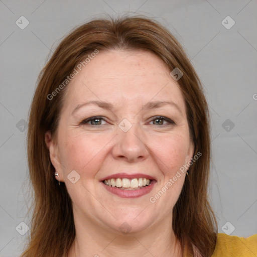 Joyful white adult female with medium  brown hair and grey eyes