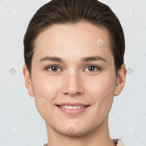 Joyful white young-adult female with short  brown hair and brown eyes