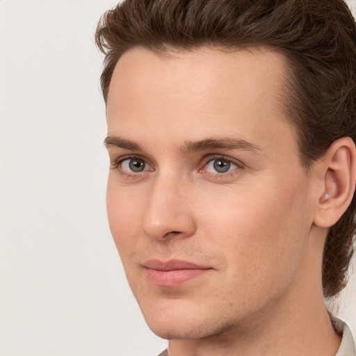 Joyful white young-adult male with medium  brown hair and brown eyes