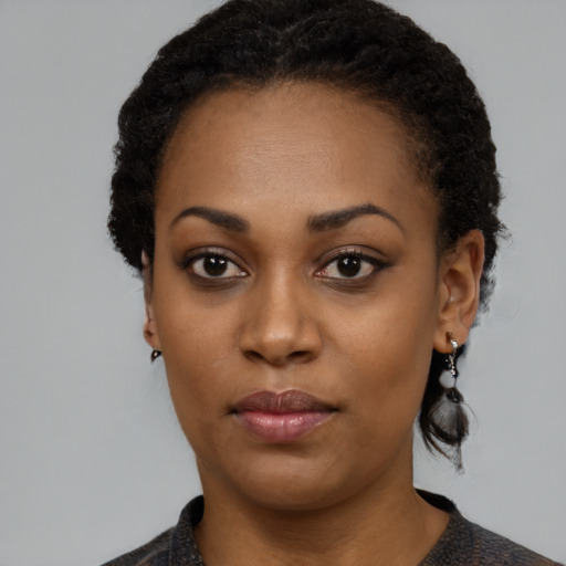 Neutral black young-adult female with medium  black hair and brown eyes