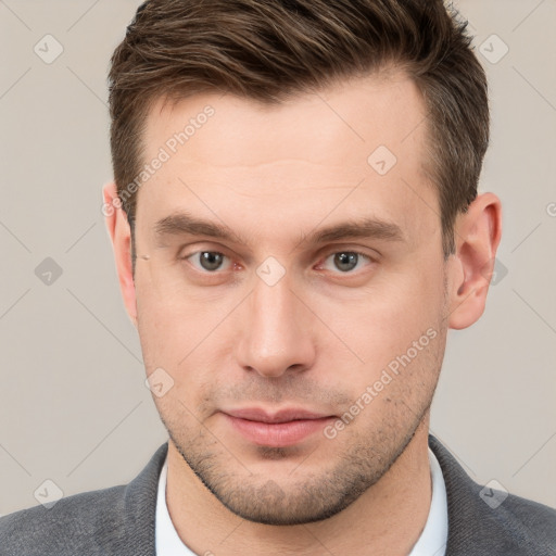 Neutral white young-adult male with short  brown hair and grey eyes