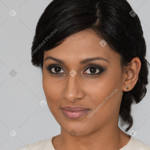 Joyful black young-adult female with medium  brown hair and brown eyes