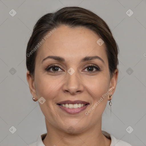 Joyful white adult female with medium  brown hair and brown eyes