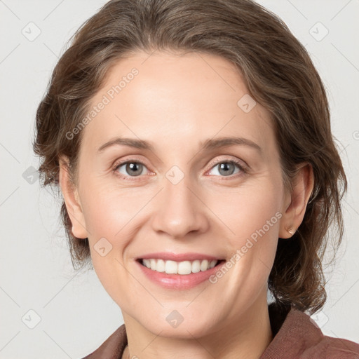 Joyful white young-adult female with medium  brown hair and grey eyes