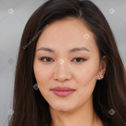 Joyful asian young-adult female with long  brown hair and brown eyes