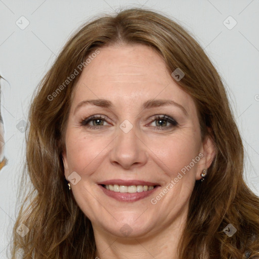 Joyful white adult female with long  brown hair and brown eyes