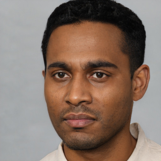 Neutral latino young-adult male with short  black hair and brown eyes