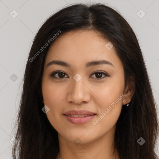 Joyful latino young-adult female with long  brown hair and brown eyes