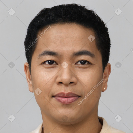 Joyful latino young-adult male with short  black hair and brown eyes