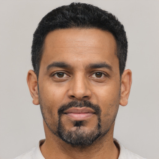 Neutral black adult male with short  black hair and brown eyes