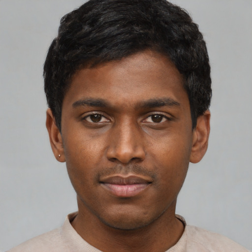Neutral black young-adult male with short  black hair and brown eyes