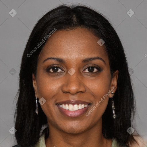 Joyful black young-adult female with long  brown hair and brown eyes