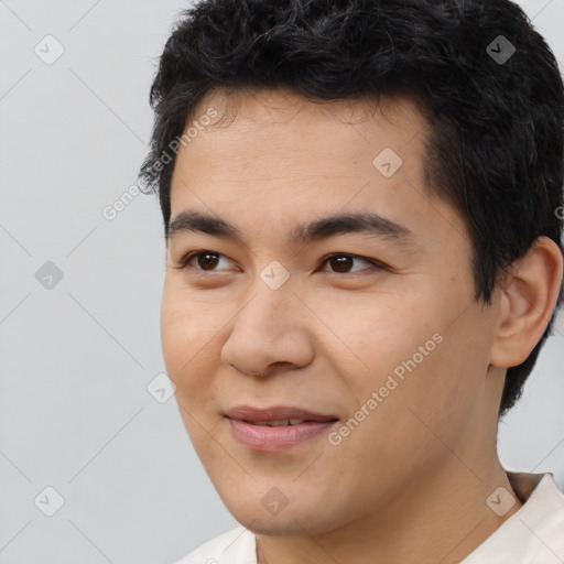 Joyful asian young-adult male with short  black hair and brown eyes