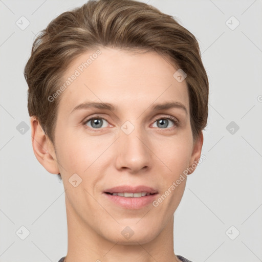 Joyful white young-adult female with short  brown hair and grey eyes