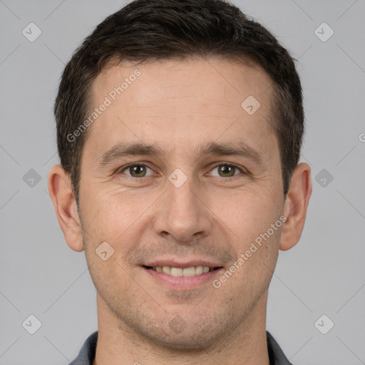 Joyful white adult male with short  brown hair and brown eyes