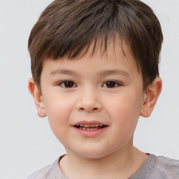 Joyful white child male with short  brown hair and brown eyes