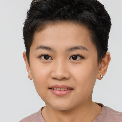 Joyful asian young-adult female with short  brown hair and brown eyes