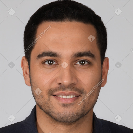 Joyful white young-adult male with short  black hair and brown eyes