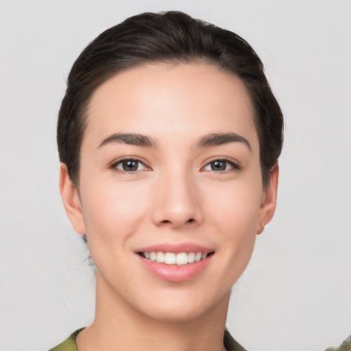 Joyful white young-adult female with medium  brown hair and brown eyes