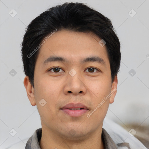 Joyful asian young-adult male with short  black hair and brown eyes