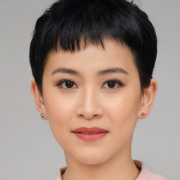 Joyful asian young-adult female with short  black hair and brown eyes