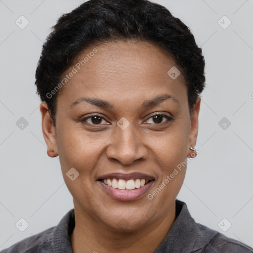 Joyful black adult female with short  brown hair and brown eyes