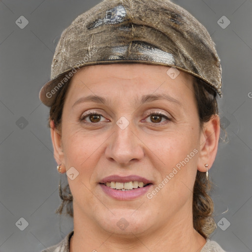 Joyful white adult female with short  brown hair and grey eyes