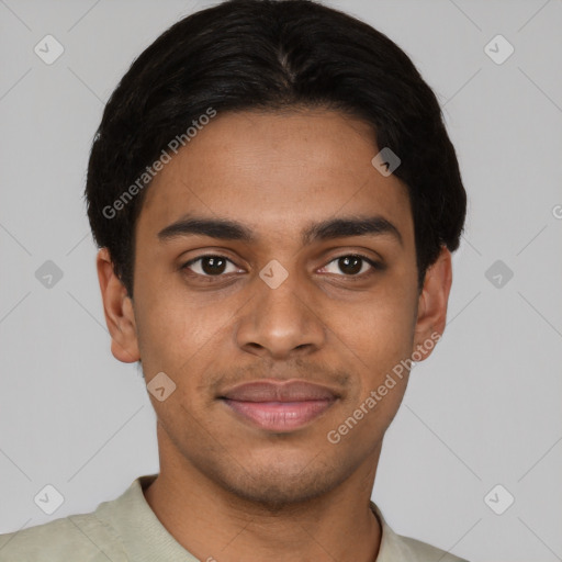 Joyful black young-adult male with short  brown hair and brown eyes