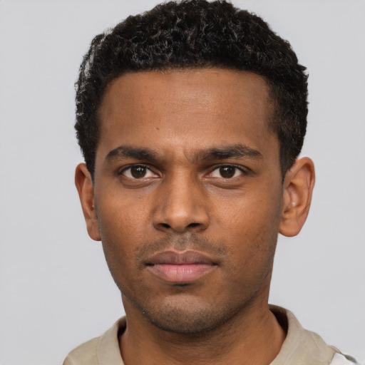 Neutral black young-adult male with short  black hair and brown eyes
