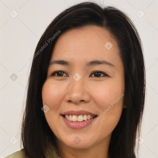 Joyful asian young-adult female with long  brown hair and brown eyes