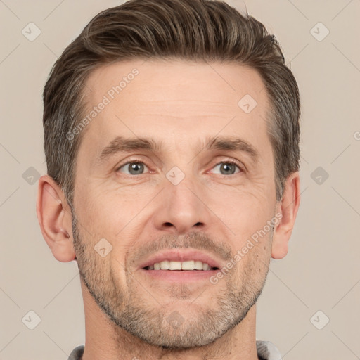 Joyful white adult male with short  brown hair and brown eyes