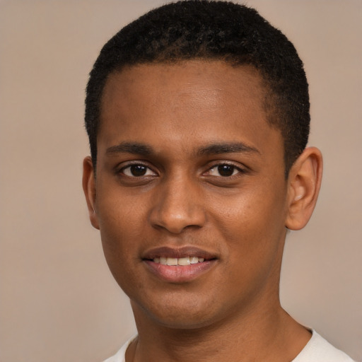 Joyful black young-adult male with short  brown hair and brown eyes