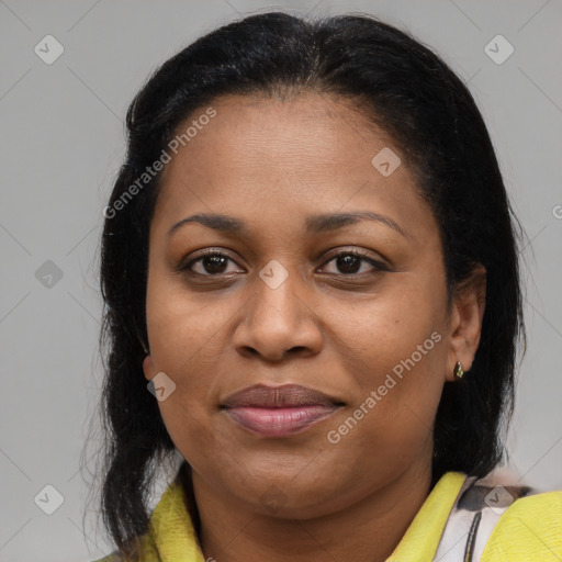 Joyful latino adult female with medium  brown hair and brown eyes