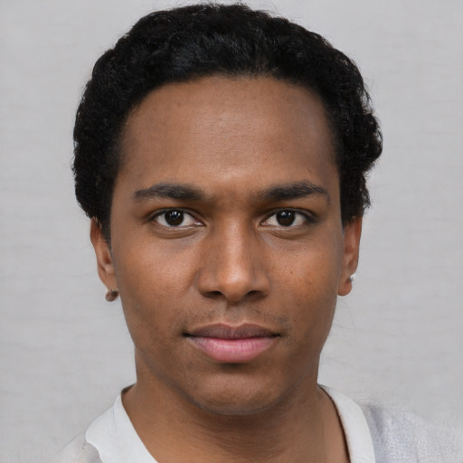 Neutral black young-adult male with short  black hair and brown eyes