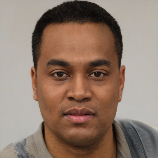 Neutral black young-adult male with short  black hair and brown eyes