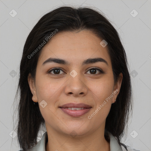 Joyful latino young-adult female with medium  brown hair and brown eyes